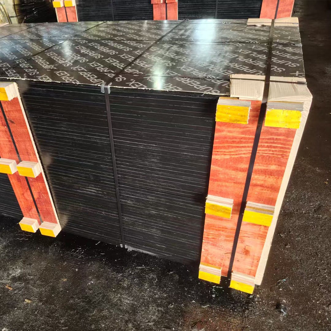 Secure industrial packing of film faced plywood bundles for export